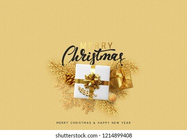 Christmas background. Bright golden decorations. Xmas greeting card. Happy New Year. Festive objects gold gifts, bauble balls, shiny snowflake.