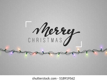 Christmas background with bright realistic garlands. Christmas glowing lights. Xmas Holiday. Greeting cards design Merry Christmas and Happy New Year lettering label.