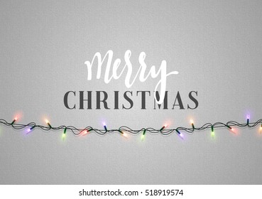 Christmas background with bright realistic garlands. Christmas glowing lights. Xmas Holiday. Greeting cards design Merry Christmas and Happy New Year lettering label.