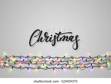 Christmas background with bright realistic garlands. Christmas glowing lights. Xmas Holiday. Greeting cards design