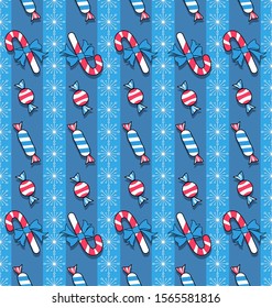 Christmas background with candies, striped lollipops and snowflakes. Holiday seamless pattern. Winter striped background. Christmas and New Year decorations.