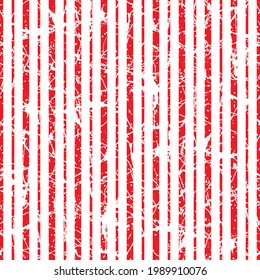 Christmas background of candy cane red white stripes with shabby cracks effect.