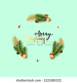 Christmas background of a circular frame with pine branches and xmas balls. Handwritten text Merry Christmas and Happy New Year. Holiday greeting card, banner, web poster