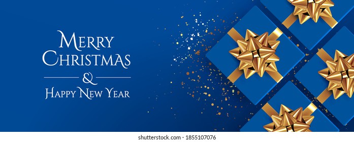 Christmas background. Classic blue christmas banner design with realistic top view gift boxes with golden bows and glitter confetti and Merry Christmas and Happy New Year lettering. Vector