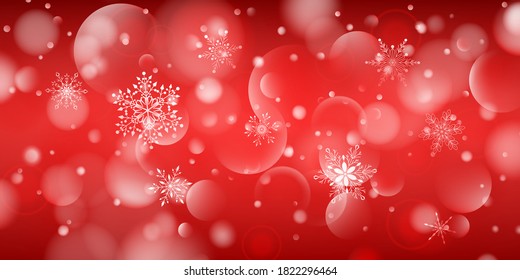 Christmas background of complex big and small falling snowflakes in red colors with bokeh effect