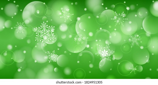 Christmas background of complex big and small falling snowflakes in green colors with bokeh effect