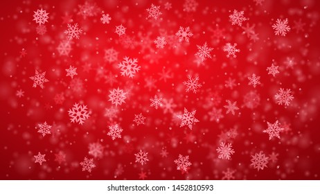 Christmas background of complex blurred and clear falling snowflakes in red colors with bokeh effect