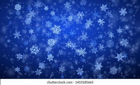 Christmas background of complex blurred and clear falling snowflakes in blue colors with bokeh effect