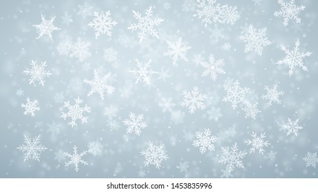 Christmas background of complex blurred and clear falling snowflakes in light blue colors with bokeh effect