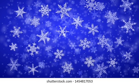 Christmas background of complex blurred and clear falling snowflakes in blue colors with bokeh effect