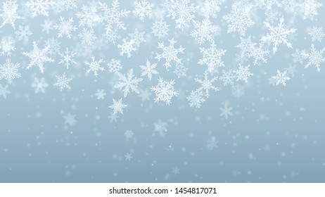 Christmas background of complex blurred and clear falling snowflakes in gray colors with bokeh effect