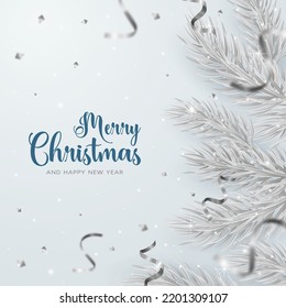 Christmas background with confetti and serpentine. Silver branches of the Christmas tree on a light background.