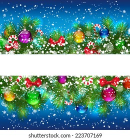 Christmas background with decorated branches of Christmas tree.
