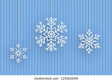 Christmas background with decorative snowflake. Knit pattern with falling snow in papercut style. Merry Christmas and Happy New Year Greetings card. Paper cut snowflakes design.