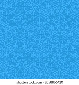 Fondo de Navidad con diferentes copos de nieve en azul