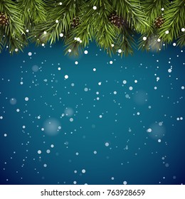 Christmas background with fir branches and pine cones on blue background