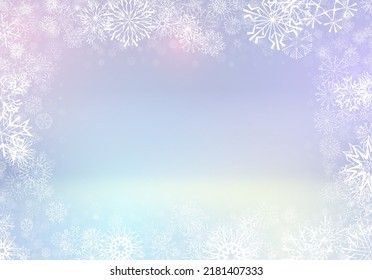 Christmas background or frame with small snowflakes layered around in blurred lights.