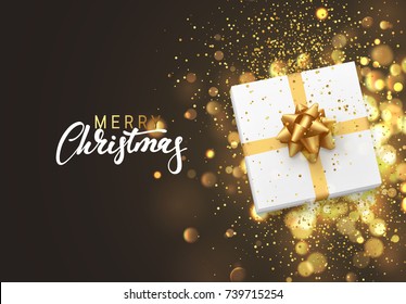 Christmas background with gift box and golden lights bokeh. Xmas greeting card.