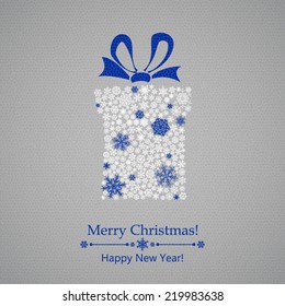 Christmas background with gift box made of snowflakes, with bow
