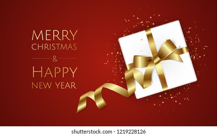 Christmas background with gift box and ribbons. Christmas greeting card or poster template.