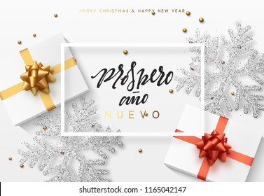 Christmas background with gifts box and shining snowflakes. Spanish text Prospero ano Nuevo (Translation Happy New Year and Merry Christmas)