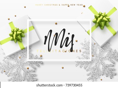 Christmas background with gifts box and shining snowflakes. Spanish text Mis felicitaciones