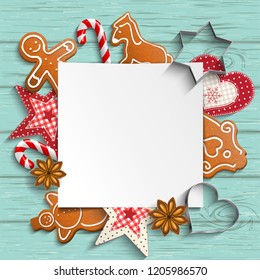 Christmas background with gingerbread and traditional ornaments, candy canes and anise stars laying on blue wooden desk, vector illustration, eps 10 with transparency
