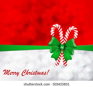 Christmas background with green bow and candy