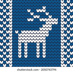 Christmas background. Knitted pattern
deer. Winter knitted pattern in blue tones.
