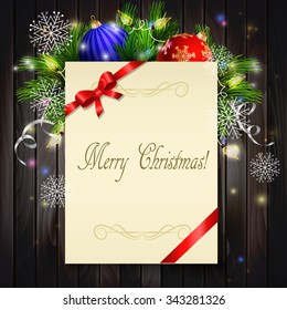 Christmas background with paper ribbon and lights on a dark wood wall and decorations