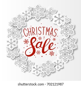 Christmas background with paper snowflakes round frame