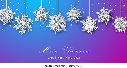 Christmas background of paper snowflakes with soft shadows, white on blue and purple background