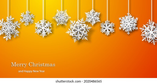 Christmas background of paper snowflakes with soft shadows, white on orange background