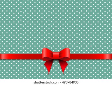 Christmas background with polka dots and red bow.