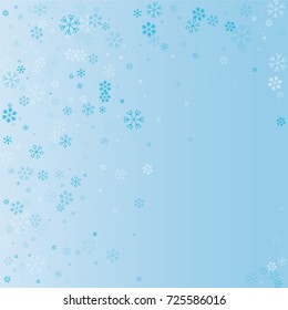 Christmas background with random scatter explosion of falling blue snowflakes on a blue background.
