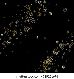 Christmas background with random scatter falling golden snowflakes isolated on black.