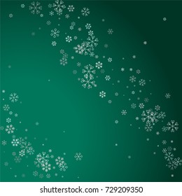 Christmas background with random scatter falling silver snowflakes isolated on a dark green gradient background