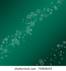 Christmas background with random scatter falling silver snowflakes isolated on a dark green gradient background
