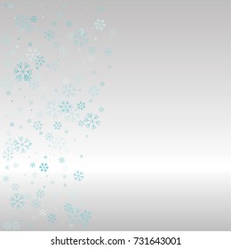 Christmas background with random scatter falling blue snowflakes on a silvery background.