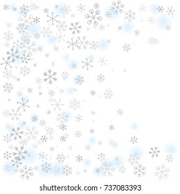 Christmas background with random scatter falling silver snowflakes and blue blurred dots isolated on white.
