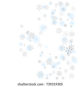 Christmas background with random scatter falling silver snowflakes and blue blurred dots isolated on white.