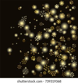 Christmas background with random scatter falling gold snowflakes and yellow blurred lights isolated on black.
