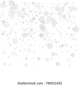 Christmas background with random scatter falling silver snowflakes isolated on black.