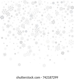 Christmas background with random scatter falling silver snowflakes isolated on white.