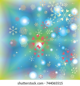 Christmas background with random scatter falling colorful snowflakes and bright lights and sparkles on a blue and green background.