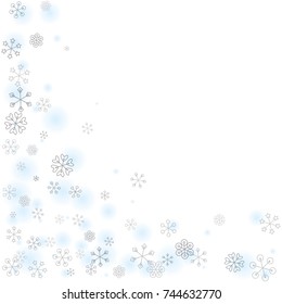 Christmas background with random scatter falling silver snowflakes and blue blurred dots isolated on white.