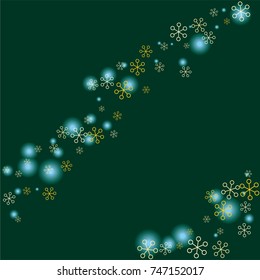 Christmas background with random scatter falling golden snowflakes and blue blurred lights on a dark green background.