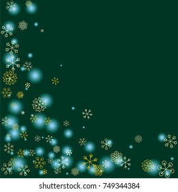 Christmas background with random scatter falling golden snowflakes and blue blurred lights on a dark green background.