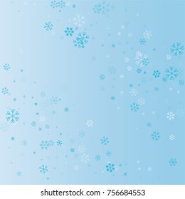 Christmas background with random scatter falling blue snowflakes on a blue background.