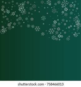 Christmas background with random scatter falling silver snowflakes isolated on a dark green gradient background